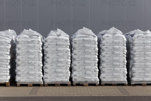 Stacked bags of potting soil and garden mulch for the spring shop