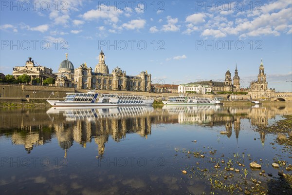 City view with steamers and reflection in the river Elbe