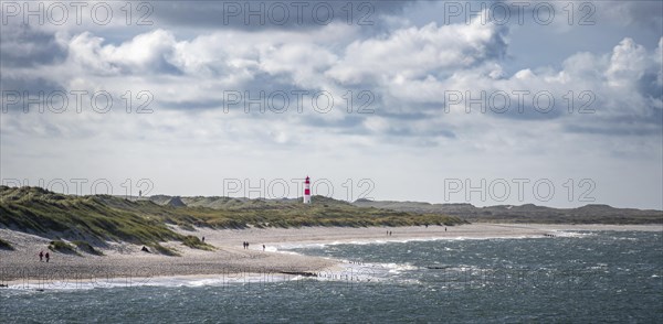 Sea and red-white lighthouse List-East in the dunes