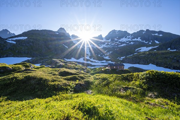 Sun shining on mountains with snow