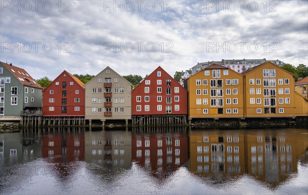 Colourful historic warehouses by the river Nidelva