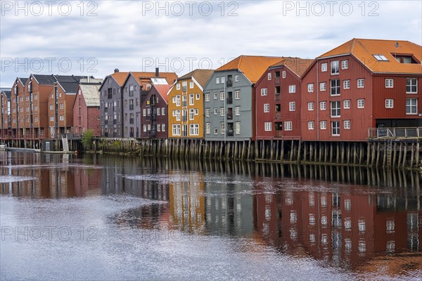 Colourful historic warehouses by the river Nidelva