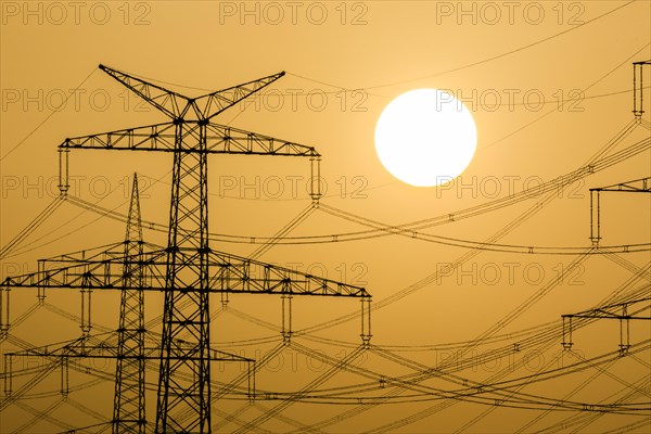 Power pylons at sunset