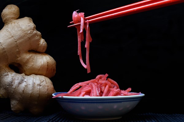 Pickled ginger on chopsticks
