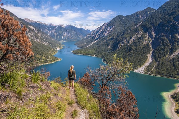Hiker walking at Plansee