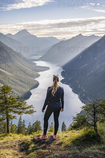 Hiker looking at Plansee