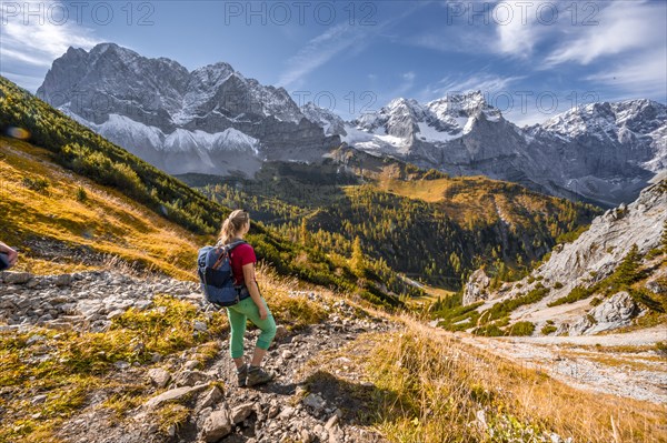 Hiker on hiking trail in the mountains