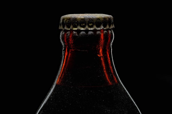 Old bottle with crown cork