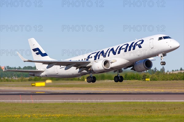 A Finnair Embraer 190 aircraft with registration OH-LKF takes off from Helsinki Airport