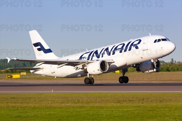 A Finnair Airbus A320 with the registration OH-LXK takes off from Helsinki Airport