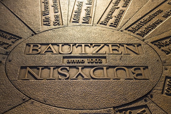Relief plate in the floor with lettering Bautzen