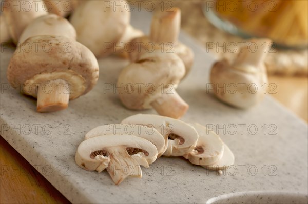 Delicious fresh sliced mushrooms on a cutting board