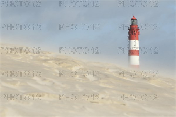 Lighthouse in dune landscape
