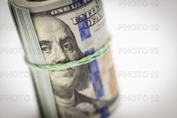 Abstract roll of newly designed U.S. one hundred dollar bills