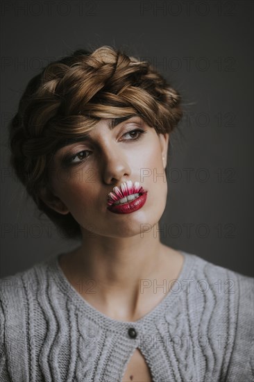 Young woman with flower lips