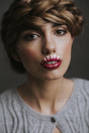 Young woman with flower lips