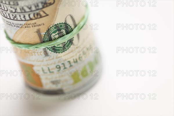Abstract roll of newly designed U.S. one hundred dollar bills
