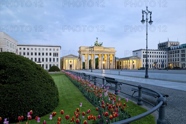 Illuminated Brandenburg Gate with Pariser Platz in the early morning