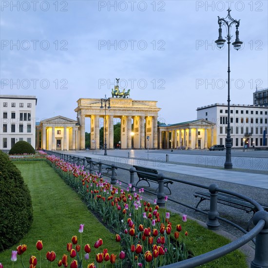 Illuminated Brandenburg Gate with Pariser Platz in the early morning