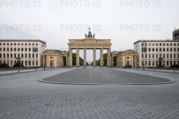Brandenburg Gate with empty Pariser Platz in the early morning