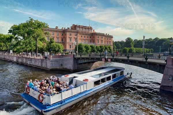 Tourists on a boat near the Mikhailovsky Castle