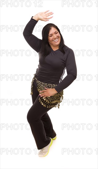 Attractive hispanic woman dancing zumba on a white background