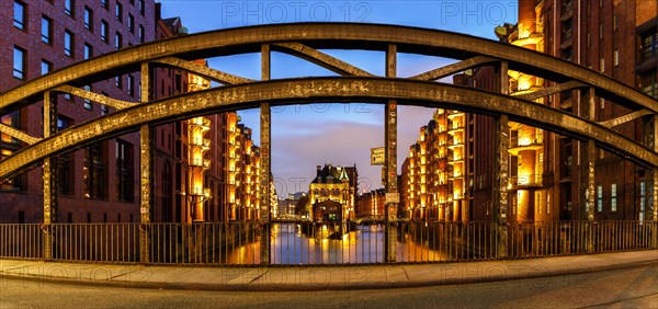 Moated castle Speicherstadt castle panorama at night in Hamburg