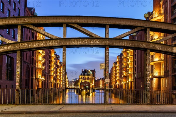 Moated castle Speicherstadt castle by night in Hamburg