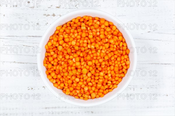 Red lentils raw from top wooden board in Germany