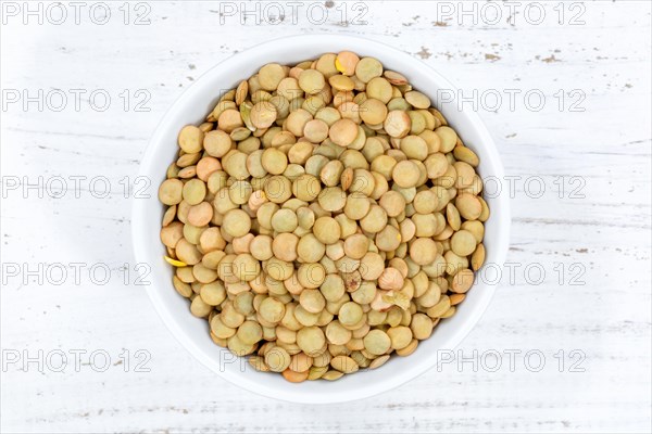 Green lentils raw from top wooden board in Germany