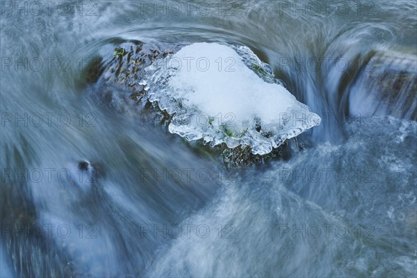 Icicles on wild river in nature reserve Hoelle