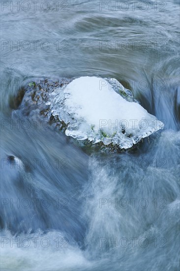 Icicles on wild river in nature reserve Hoelle