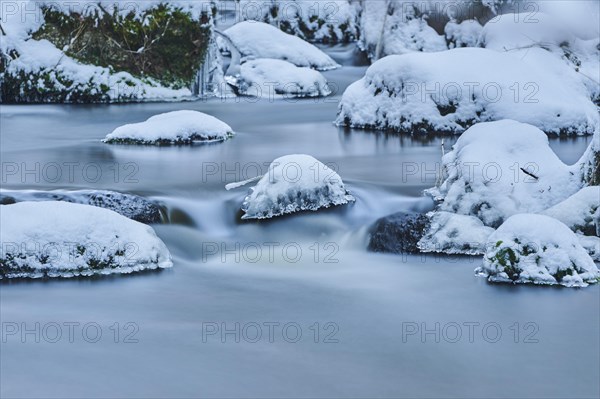 Icicles on wild river in nature reserve Hoelle