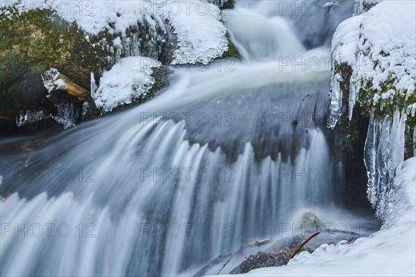Icicles on wild river in nature reserve Hoelle
