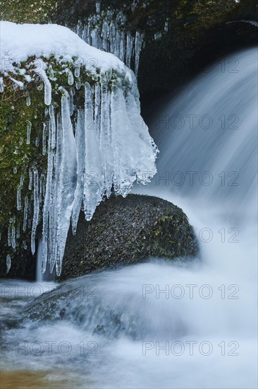 Icicles on wild river in nature reserve Hoelle