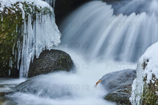 Icicles on wild river in nature reserve Hoelle