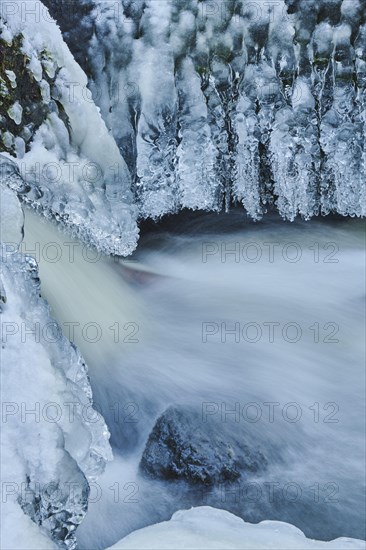 Icicles on the bank of the torrent Hoellbach