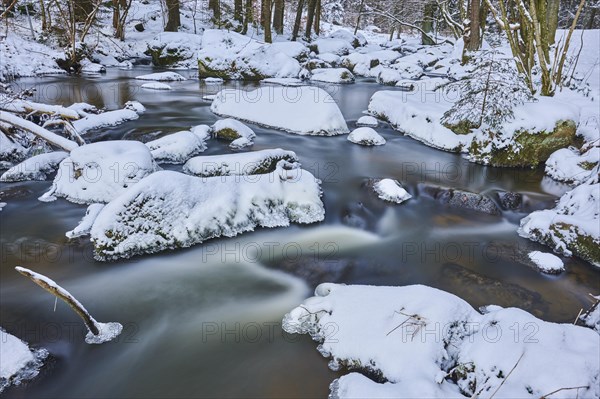 Wild river Hoellbach flows through in winter