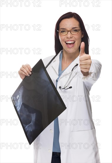 Attractive mixed-race female nurse or doctor wearing lab coat and stethoscope holding x-ray giving a thumbs up isolated on a white background