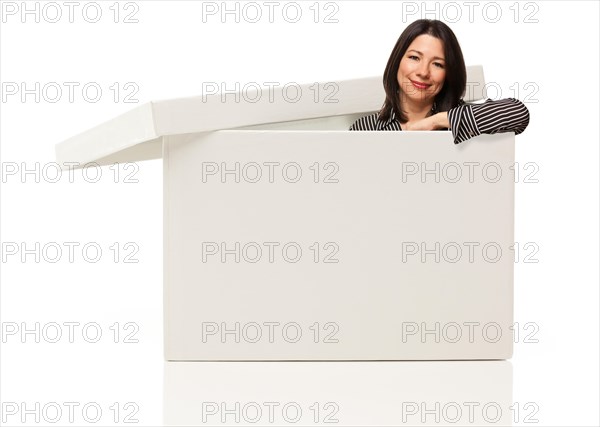 Pretty multiethnic woman standing inside blank white box isolated on a white background