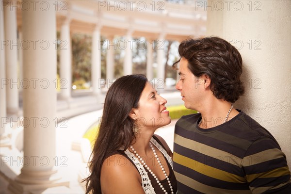 Happy attractive hispanic couple enjoying themselves at the park