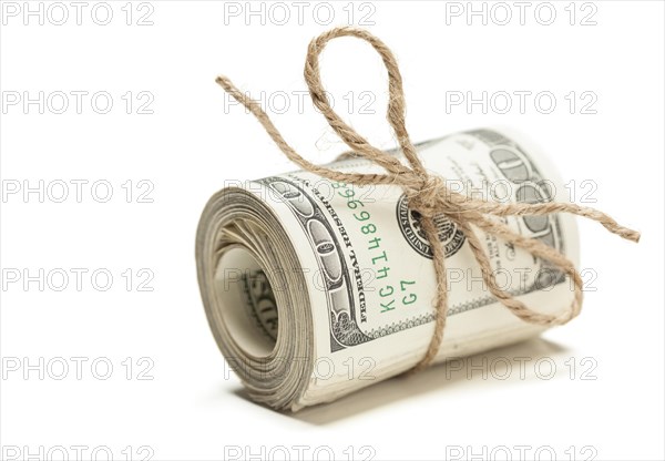 Roll of one hundred dollar bills tied in burlap string isolated on a white background