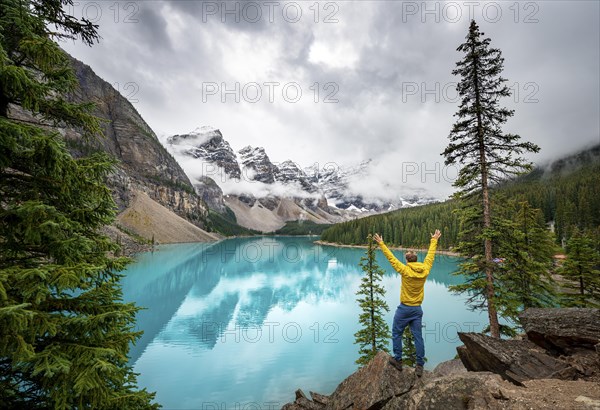 Young man stretching his arms in the air