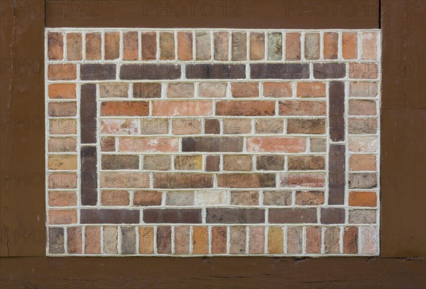 Pointing stones as patterns on the church wall in half-timbering