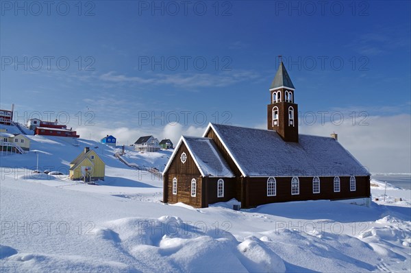 Wooden church in winter landscape