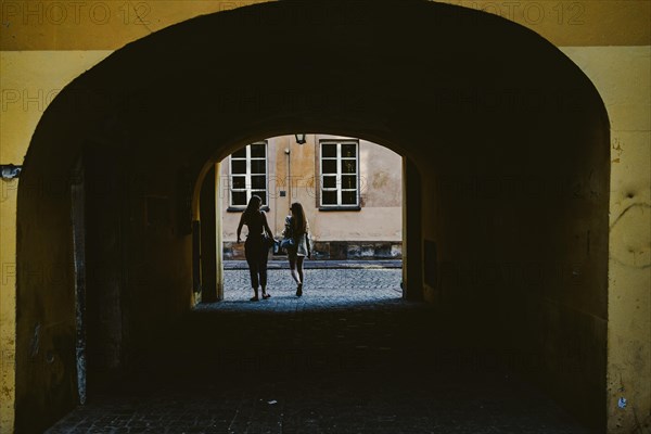 Girls coming out of the yard gate