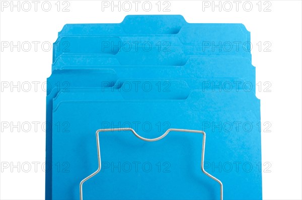 Blue file folders in rack isolated on a white background. labels ready for your own text