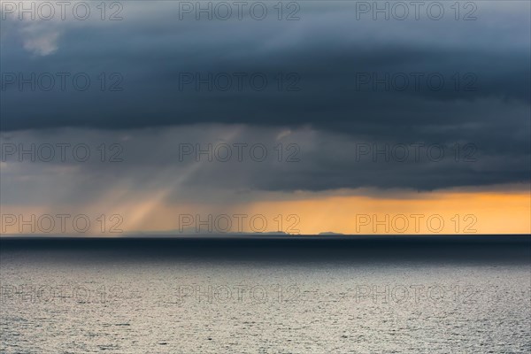 Rain clouds at sunset