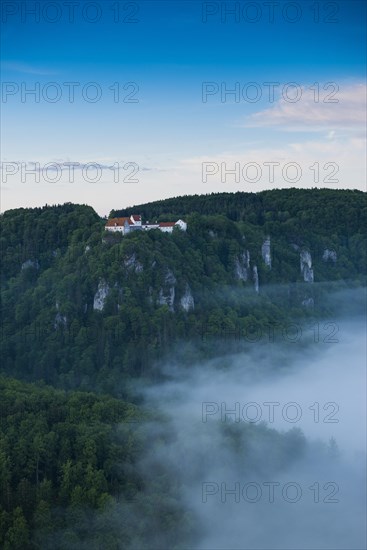 View from Eichfelsen to Wildenstein Castle with morning fog