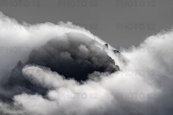 Cloudy craggy mountain